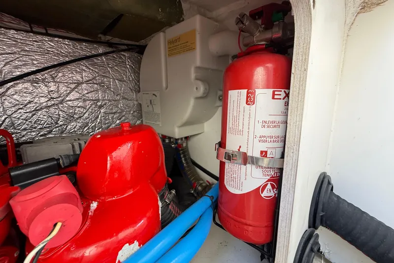 Slide: The Image of Engine compartment of 2021 Jeanneau NC 895 with fire extinguisher and equipment. - 45