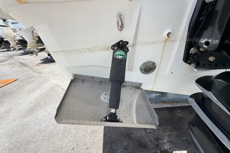 Slide: The Image of Trim tab on a 2021 Jeanneau NC 895 boat, featuring Lenco actuator. - 47