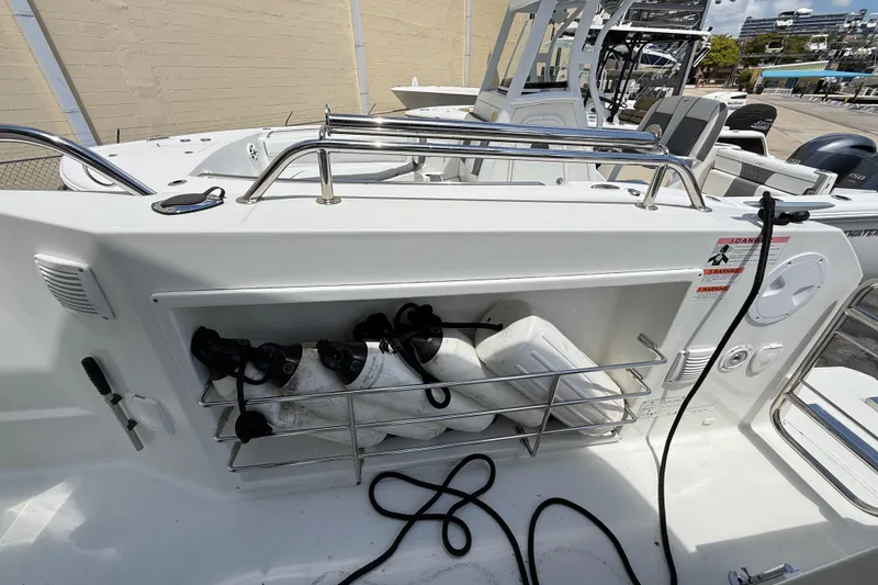 Slide: The Image of 2021 Jeanneau NC 895 boat deck with storage compartment and safety equipment. - 49