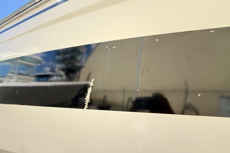 Slide: The Image of Close-up of 2021 Jeanneau NC 895 boat hull with minor surface imperfections. - 6
