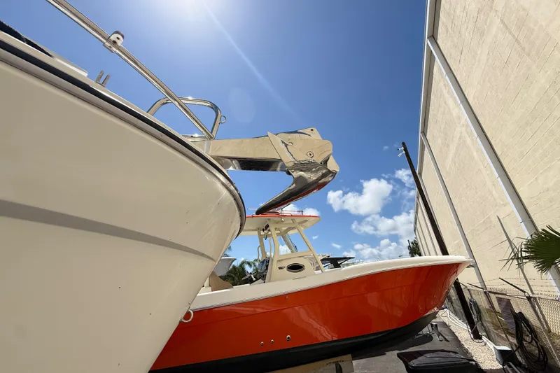 Slide: The Image of 2021 Jeanneau NC 895 boat docked under clear blue sky. - 8