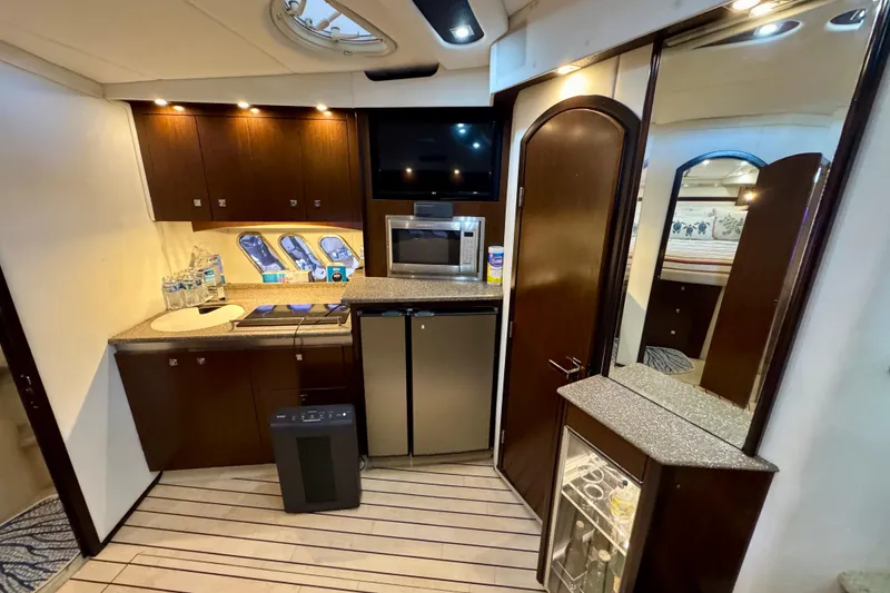 Slide: The Image of Luxurious interior of 2012 Cruisers Yachts 430 Sports Coupe with modern kitchen amenities. - 13