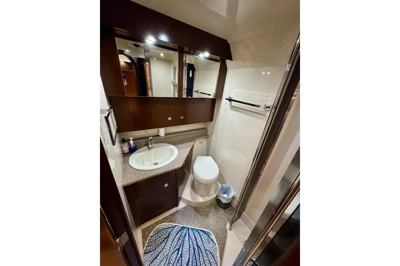 Slide: The Image of Luxurious bathroom in 2012 Cruisers Yachts 430 Sports Coupe with modern fixtures and elegant design. - 15