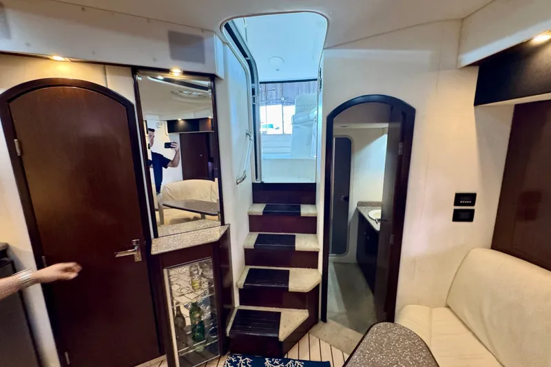 Slide: The Image of Interior of 2012 Cruisers Yachts 430 Sports Coupe with stairs and seating area. - 16