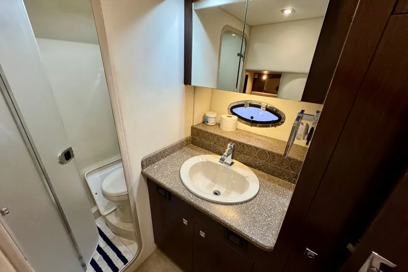 Slide: The Image of Luxurious bathroom in 2012 Cruisers Yachts 430 Sports Coupe with modern fixtures and elegant design. - 18