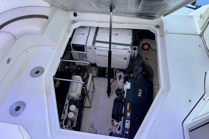Slide: The Image of Engine compartment of a 2012 Cruisers Yachts 430 Sports Coupe, showcasing mechanical components. - 23