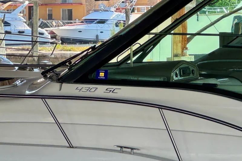 Slide: The Image of 2012 Cruisers Yachts 430 Sports Coupe docked, showcasing sleek design and modern features. - 25