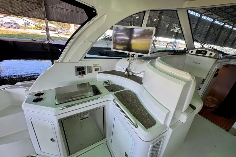 Slide: The Image of 2012 Cruisers Yachts 430 Sports Coupe interior with kitchenette and seating area. - 5