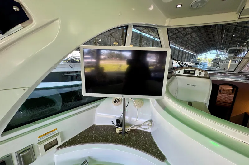 Slide: The Image of Interior of 2012 Cruisers Yachts 430 Sports Coupe with mounted TV screen. - 8