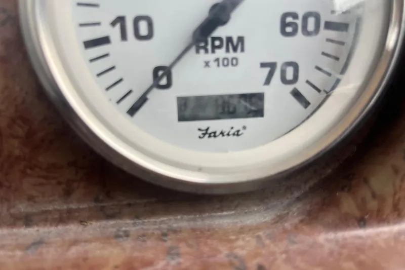 Slide: The Image of Close-up of a Faria RPM gauge on a 2008 Harris Super Sunliner 240 boat. - 12