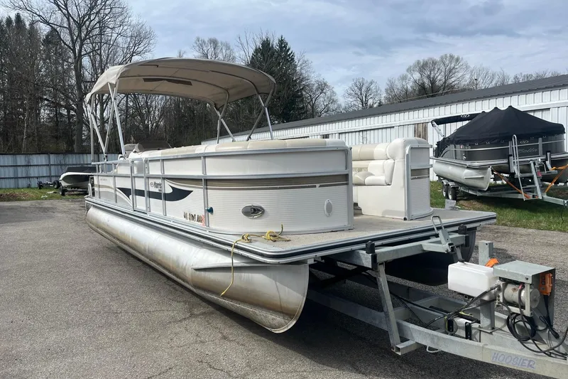 Slide: The Image of 2008 Harris Super Sunliner 240 pontoon boat on trailer, parked outdoors. - 5