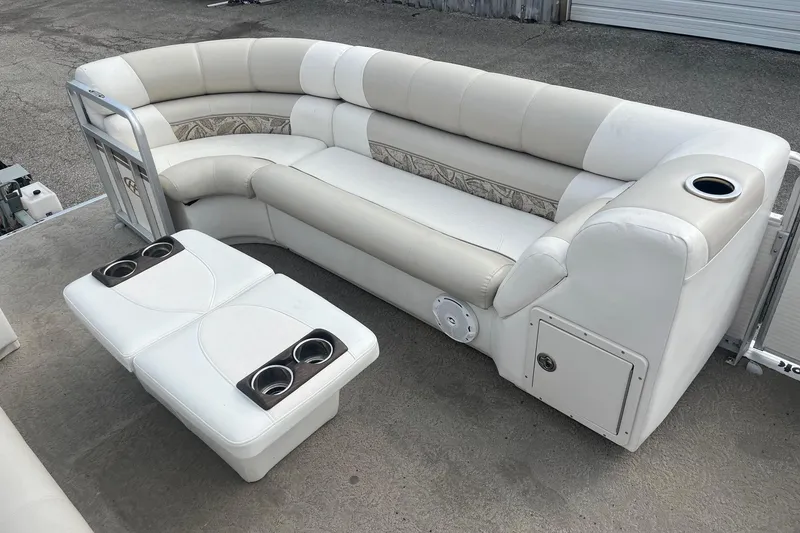 Slide: The Image of 2008 Harris Super Sunliner 240 pontoon boat interior with white seating and cup holders. - 7