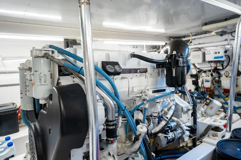 Slide: The Image of Engine room of 1983 Rybovich 55 Convertible yacht, showcasing detailed machinery and components. - 101