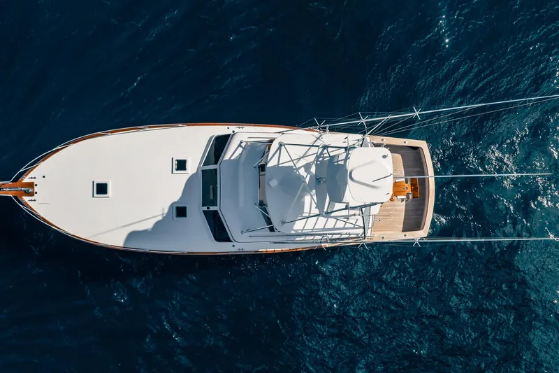 Slide: The Image of Aerial view of 1983 Rybovich 55 Convertible yacht on deep blue water. - 118