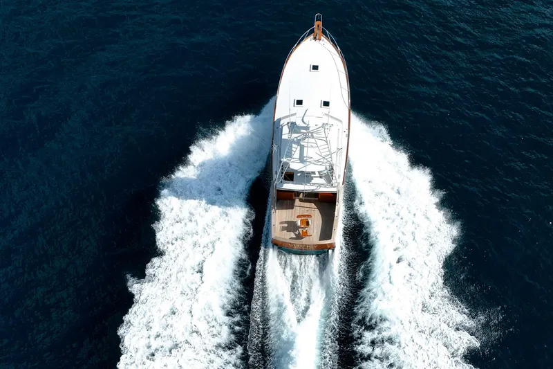 Slide: The Image of Aerial view of 1983 Rybovich 55 Convertible yacht cruising on open water. - 121