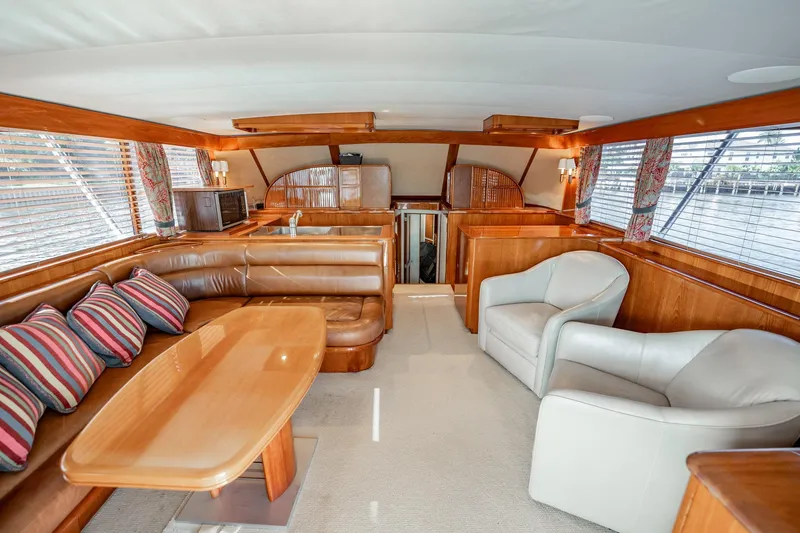 Slide: The Image of Luxurious interior of 1983 Rybovich 55 Convertible yacht with leather seating and wood accents. - 17