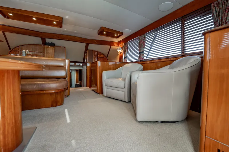 Slide: The Image of Luxurious interior of 1983 Rybovich 55 Convertible yacht with leather seating and wood accents. - 19
