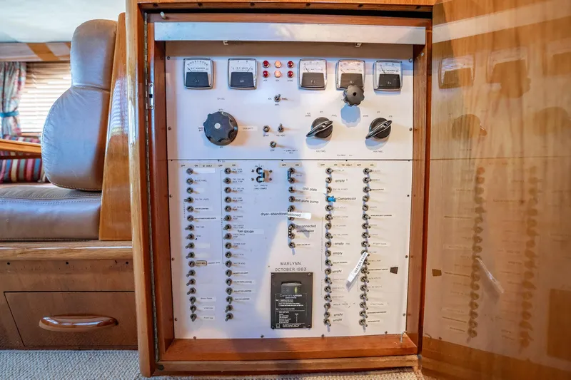 Slide: The Image of Electrical control panel inside a 1983 Rybovich 55 Convertible yacht. - 21