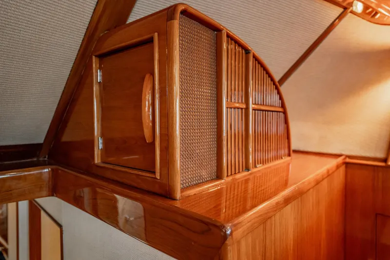 Slide: The Image of Interior of 1983 Rybovich 55 Convertible yacht with polished wooden cabinetry. - 30