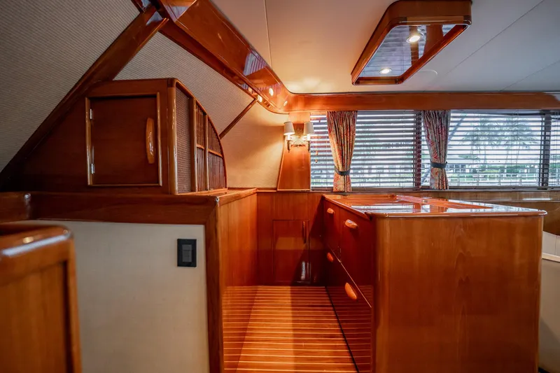 Slide: The Image of Luxurious wooden interior of a 1983 Rybovich 55 Convertible yacht with elegant cabinetry. - 31