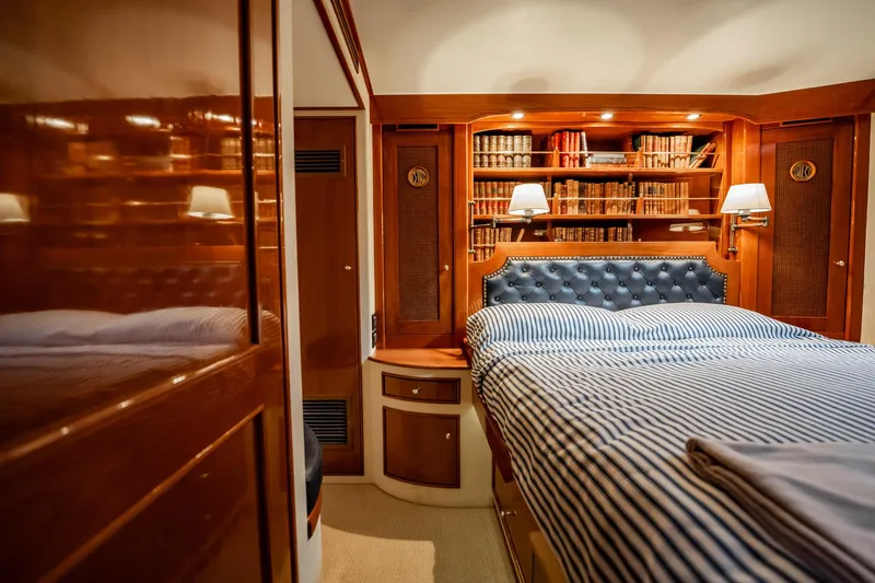 Slide: The Image of Luxurious cabin interior of 1983 Rybovich 55 Convertible yacht with elegant wood finish. - 36