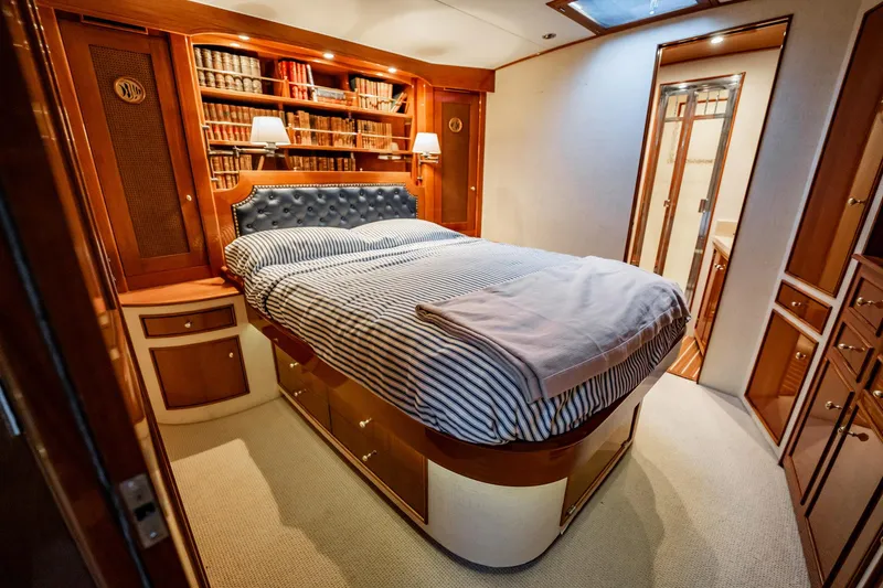Slide: The Image of Luxurious bedroom interior of 1983 Rybovich 55 Convertible yacht with elegant wood finishes. - 39