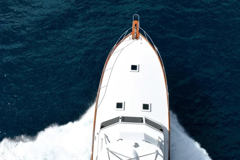 Slide: The Image of Aerial view of 1983 Rybovich 55 Convertible yacht cruising on deep blue ocean. - 55