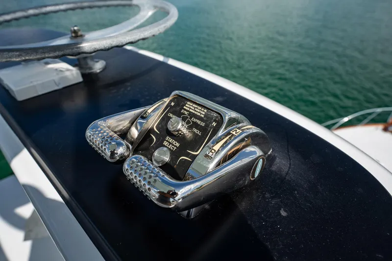 Slide: The Image of Close-up of 1983 Rybovich 55 Convertible yacht controls with steering wheel. - 78