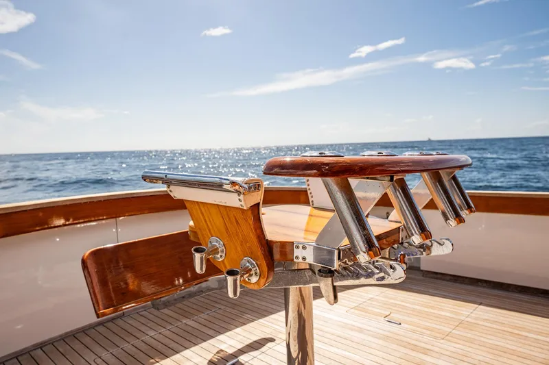 Slide: The Image of Fishing chair on 1983 Rybovich 55 Convertible yacht, ocean view in background. - 91
