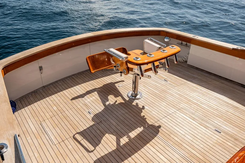 Slide: The Image of 1983 Rybovich 55 Convertible yacht deck with fishing chair, overlooking the ocean. - 92