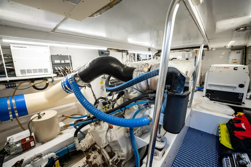 Slide: The Image of Engine room of 1983 Rybovich 55 Convertible yacht with visible machinery and equipment. - 95