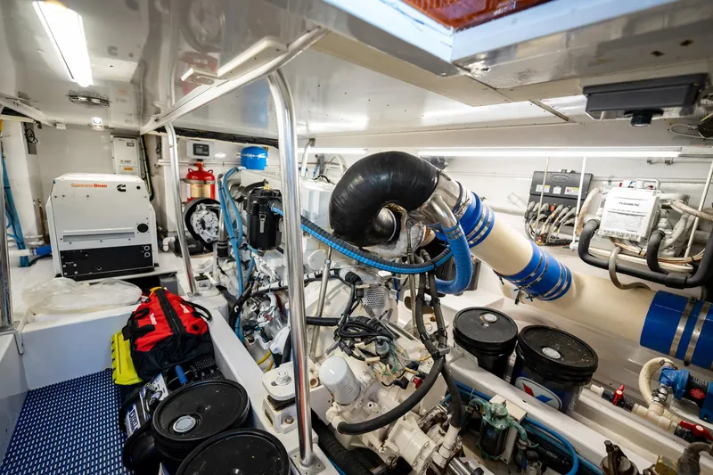 Slide: The Image of Engine room of 1983 Rybovich 55 Convertible yacht, featuring modern equipment and organized layout. - 97