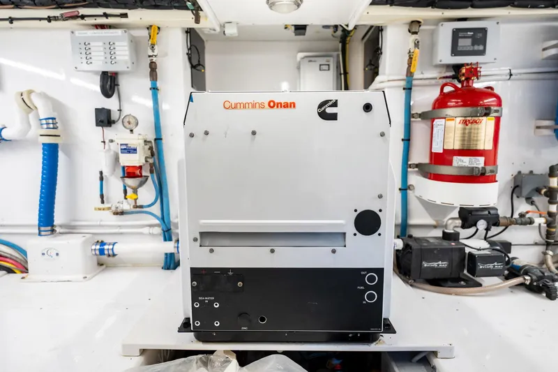 Slide: The Image of Engine room of 1983 Rybovich 55 Convertible with Cummins Onan generator. - 98