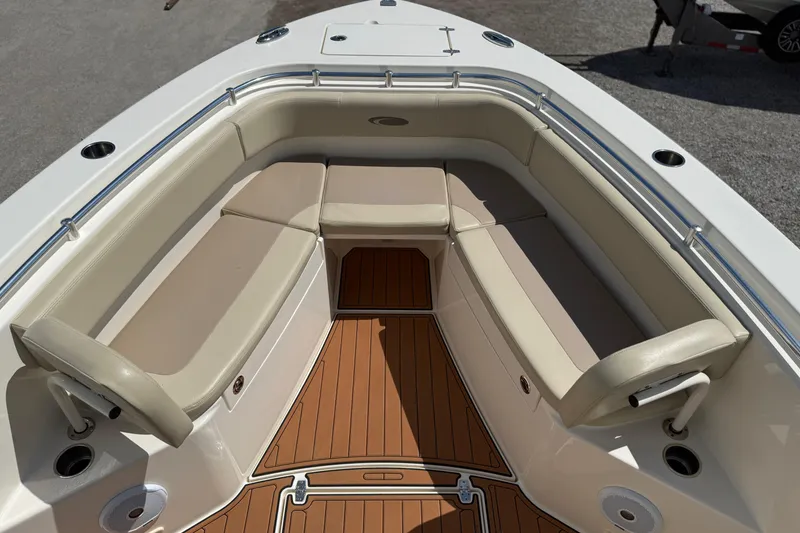Slide: The Image of 2016 Cobia 277 Center Console boat with spacious seating and teak flooring. - 18