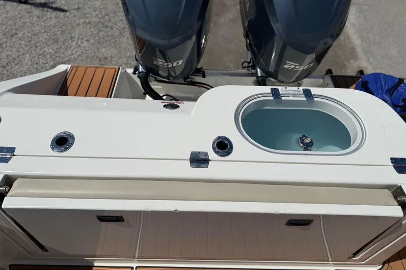 Slide: The Image of 2016 Cobia 277 Center Console boat with dual Yamaha 250 engines and livewell. - 31