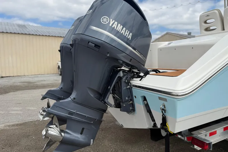 Slide: The Image of 2016 Cobia 277 Center Console with dual Yamaha outboard motors. - 38