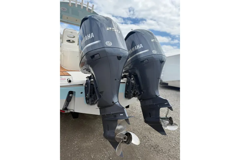 Slide: The Image of Twin Yamaha 250 outboard engines on a 2016 Cobia 277 Center Console boat. - 39
