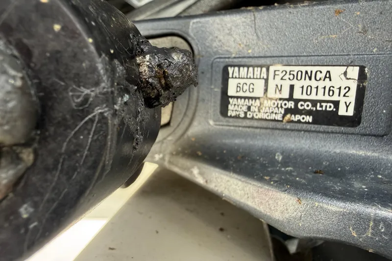 Slide: The Image of Yamaha F250NCA engine label on a 2016 Cobia 277 Center Console boat. - 53