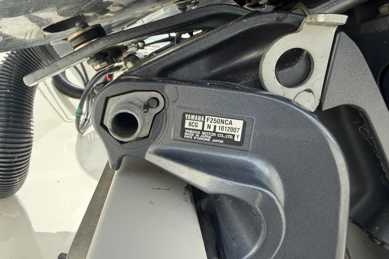 Slide: The Image of Close-up of Yamaha F250NCA engine on 2016 Cobia 277 Center Console boat. - 54