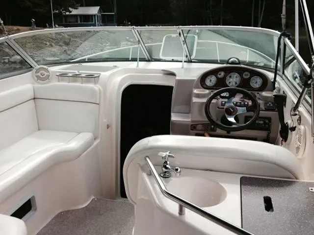 Slide: The Image of Interior of 2006 Rinker 270 Express Cruiser with helm. - 11