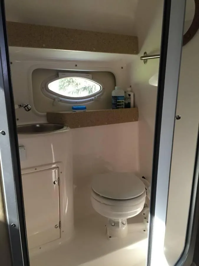 Slide: The Image of Bathroom in Rinker 270 Express Cruiser 2006. - 14