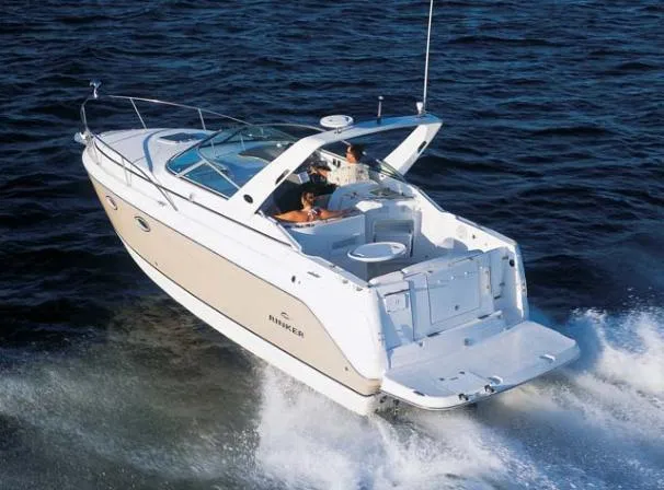 Slide: The Image of 2006 Rinker 270 Express Cruiser on the water. - 16