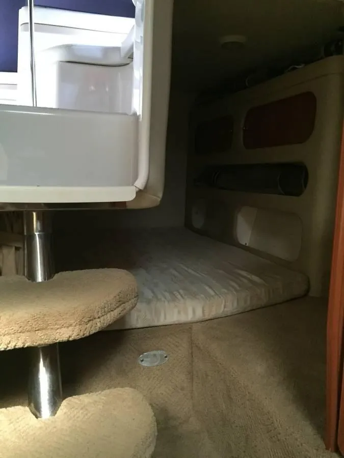 Slide: The Image of Interior of 2006 Rinker 270 Express Cruiser with sleeping area. - 7