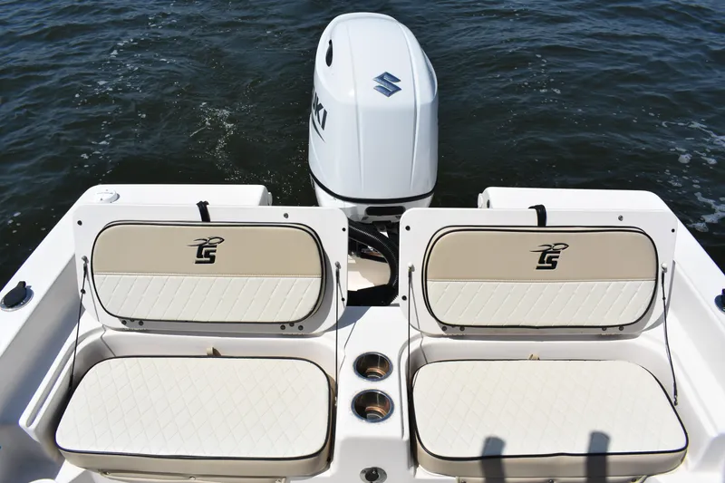 Slide: The Image of 2022 Carolina Skiff 21 Ultra Elite boat with Suzuki outboard motor on water. - 17