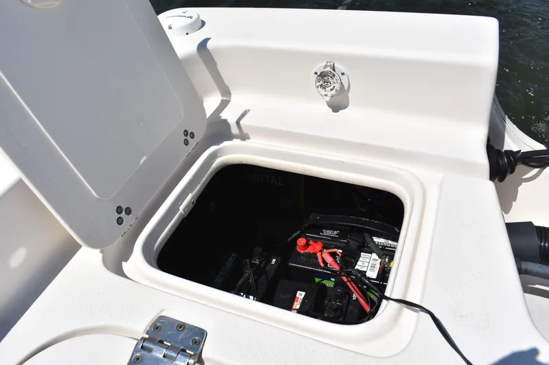 Slide: The Image of Open hatch on 2022 Carolina Skiff 21 Ultra Elite showing battery compartment. - 19