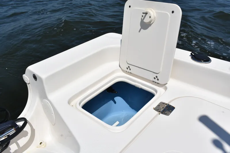 Slide: The Image of Open storage compartment on 2022 Carolina Skiff 21 Ultra Elite boat. - 20