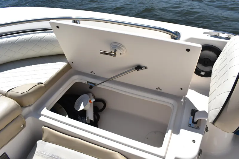 Slide: The Image of Storage compartment on a 2022 Carolina Skiff 21 Ultra Elite boat, open on the deck. - 8