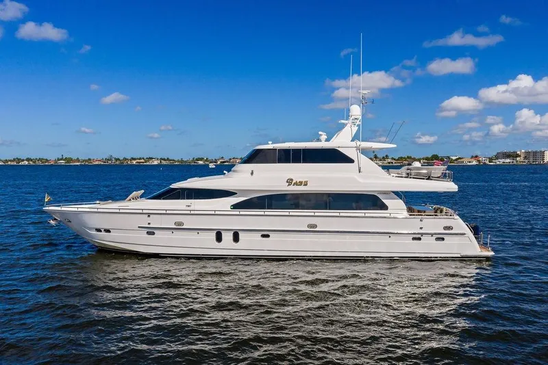The Image of Luxurious 2005 Horizon 82 yacht cruising on a sunny day with clear blue skies. - 0