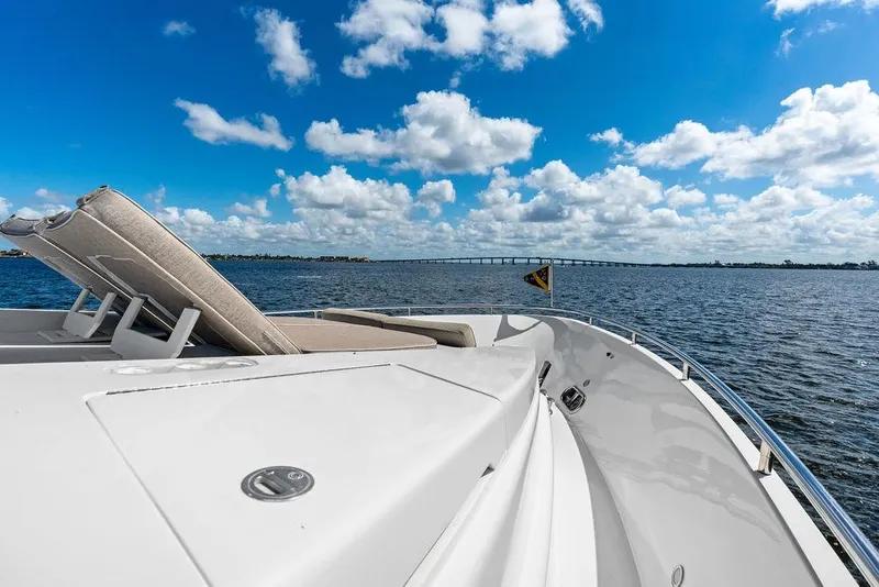 Slide: The Image of Luxury Horizon 82 yacht deck with sunbed, ocean view, and blue sky, 2005 model. - 17