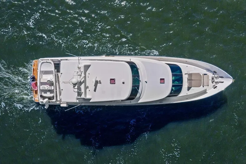Slide: The Image of Aerial view of 2005 Horizon 82 yacht cruising on open water. - 2